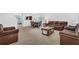 Relaxing living room with leather sofas and a coffee table at 1769 Morning Sky Dr, Winter Garden, FL 34787