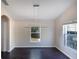 Dining room with dark hardwood floors and a modern light fixture at 221 Rosa Ave, Oviedo, FL 32765