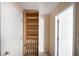 Storage closet with shelving and shoe rack at 221 Rosa Ave, Oviedo, FL 32765