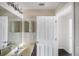 Bathroom with double vanity and access to bedroom at 221 Rosa Ave, Oviedo, FL 32765