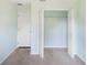 Empty bedroom closet with double doors and a hanging rod at 221 Rosa Ave, Oviedo, FL 32765
