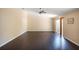Spacious Gathering room with dark hardwood floors and sliding glass doors at 221 Rosa Ave, Oviedo, FL 32765