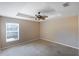 Primary bedroom with ceiling fan and window at 221 Rosa Ave, Oviedo, FL 32765