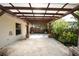 Covered patio with stone tile flooring and pergola at 221 Rosa Ave, Oviedo, FL 32765