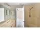 Primary bathroom with double vanity, access to bedroom and shower at 221 Rosa Ave, Oviedo, FL 32765