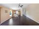 Open concept Gathering room with dark hardwood floors and kitchen views at 221 Rosa Ave, Oviedo, FL 32765