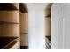 Spacious walk-in closet with built-in shelves and rods at 221 Rosa Ave, Oviedo, FL 32765