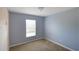 Light-purple painted bedroom with window and carpet at 221 Rosa Ave, Oviedo, FL 32765