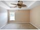 Primary bedroom with ceiling fan and window at 221 Rosa Ave, Oviedo, FL 32765