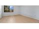 Simple bedroom with hardwood floors and window at 2205 Cypress Cove Dr, Tavares, FL 32778