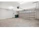 Spacious garage with ample storage space and overhead storage at 2205 Cypress Cove Dr, Tavares, FL 32778