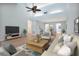 Bright living room with hardwood floors and vaulted ceiling at 2205 Cypress Cove Dr, Tavares, FL 32778