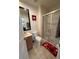 Clean bathroom with shower, toilet and Mickey Mouse themed bathmat at 3004 Red Ginger Rd, Kissimmee, FL 34747