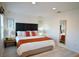 Main bedroom with king-size bed, dark headboard, and wood nightstand at 3004 Red Ginger Rd, Kissimmee, FL 34747