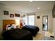 Mickey Mouse themed bedroom with twin beds, nightstands, and wood flooring at 3004 Red Ginger Rd, Kissimmee, FL 34747