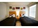 Mickey Mouse themed bedroom with twin beds, nightstands, and wood flooring at 3004 Red Ginger Rd, Kissimmee, FL 34747