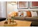 Wooden coffee table with flowers and decorative objects at 3004 Red Ginger Rd, Kissimmee, FL 34747