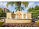 Encantada community entrance with fountain and landscaping at 3004 Red Ginger Rd, Kissimmee, FL 34747