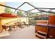 Relaxing patio with hot tub, lounge chairs, and outdoor table at 3004 Red Ginger Rd, Kissimmee, FL 34747