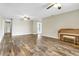 Bright and airy living room with hardwood floors and neutral walls at 10 Locust Run Crse, Ocala, FL 34472