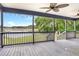 Spacious deck overlooking a tranquil pond and lush landscape at 10 Locust Run Crse, Ocala, FL 34472