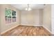 Simple dining area with hardwood flooring and large windows at 10 Locust Run Crse, Ocala, FL 34472
