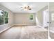 Main bedroom with neutral walls, ceiling fan, and plush carpeting at 10 Locust Run Crse, Ocala, FL 34472