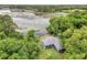 House nestled in lush greenery near a serene lake at 10 Locust Run Crse, Ocala, FL 34472