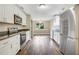 Modern kitchen with white cabinets, granite countertops and stainless steel appliances at 10 Locust Run Crse, Ocala, FL 34472