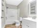 Clean bathroom with white vanity, shower/tub combo, and wood-look flooring at 10 Locust Run Crse, Ocala, FL 34472