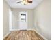 Bright bedroom featuring wood-look floors and exterior access at 10 Locust Run Crse, Ocala, FL 34472