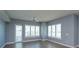 Spacious living room with ceiling fan and large windows at 100 S Eola Dr # 609, Orlando, FL 32801