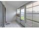 Bright screened porch with tiled floor and backyard access at 4548 Summergrove Ave, Orlando, FL 32812