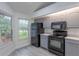Updated kitchen featuring gray cabinets and stainless steel appliances at 4548 Summergrove Ave, Orlando, FL 32812