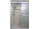 Clean shower with sliding glass doors and tiled walls at 4548 Summergrove Ave, Orlando, FL 32812