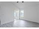 Spacious bedroom with gray flooring, a ceiling fan, and sliding glass doors at 4548 Summergrove Ave, Orlando, FL 32812