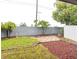 Small backyard with gravel, grass, and a block wall at 4548 Summergrove Ave, Orlando, FL 32812