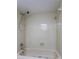 Clean bathroom with a shower/tub combo and neutral-toned tile at 4548 Summergrove Ave, Orlando, FL 32812