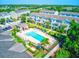 Community pool and townhomes aerial view, showing resort-style amenities at 590 Piazza Pt, Oviedo, FL 32765