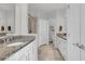 Elegant bathroom with double vanity, granite countertop and shower at 590 Piazza Pt, Oviedo, FL 32765