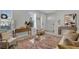 Open living area showcasing a cozy seating arrangement and tasteful artwork at 590 Piazza Pt, Oviedo, FL 32765