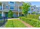 Townhouse exterior with manicured lawn and landscaping at 590 Piazza Pt, Oviedo, FL 32765