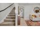 Modern carpeted staircase with simple, yet elegant design at 590 Piazza Pt, Oviedo, FL 32765