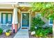 Inviting townhouse entryway with lush landscaping at 590 Piazza Pt, Oviedo, FL 32765