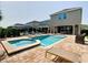 Resort-style pool and spa with a spacious patio at 201 Burma St, Kissimmee, FL 34747