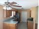 Galley kitchen with wood cabinets and teal countertops at 32525 Oak Park Dr, Leesburg, FL 34748