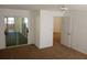 Large bedroom with carpet, mirrored closet doors, and access to another room at 32525 Oak Park Dr, Leesburg, FL 34748