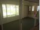Bright sunroom with sliding glass doors and view of backyard at 32525 Oak Park Dr, Leesburg, FL 34748