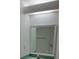 Simple bathroom with a large mirror and a teal vanity at 32525 Oak Park Dr, Leesburg, FL 34748