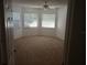 Bright bedroom with bay window and ceiling fan at 32525 Oak Park Dr, Leesburg, FL 34748